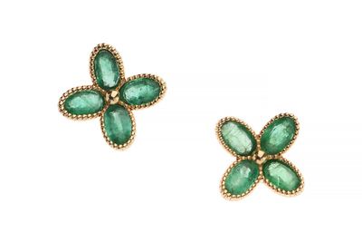 a pair of emerald flower earrings on a white background