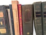 many books that are lined up on a shelf