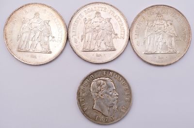 four different types of coins are shown on a white surface