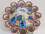 a decorative bowl with a picture of a person on it
