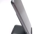 a close up of a cell phone on a stand