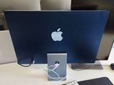 an apple computer sitting on a desk with a keyboard and mouse