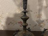 two candles that are sitting on a wooden table