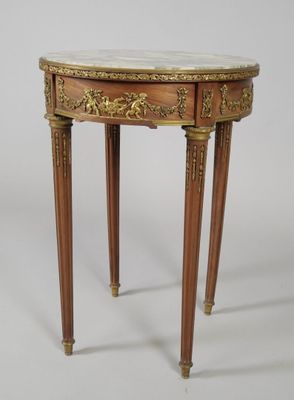 a small table with a marble top and wooden legs