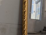 a mirror that is sitting on the floor in a room