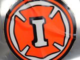 a close up of a motorcycle with an orange and black sticker on it