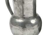 a silver pitcher with a handle on a white background
