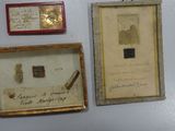 three framed pictures on the wall of a room
