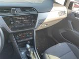 a dashboard of a car with a steering control