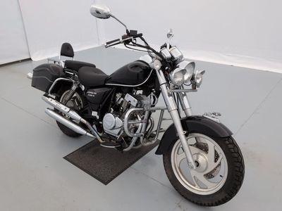 a black motorcycle that is parked in a room