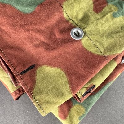 a close up of a pair of pants with buttons on them