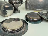a lot of silver items that are on the table