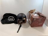 a helmet and a bag sitting on a counter
