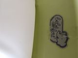 a close up of a surfboard with a sticker on it