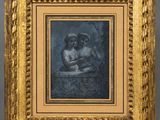 un tableau représentant une femme et un enfant, dans un cadre doré