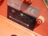 a label on the back of a tractor that is parked