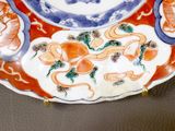 a plate with a design on it sitting on a table