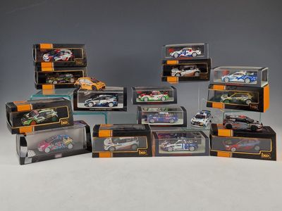 a group of six diecast cars in a display case