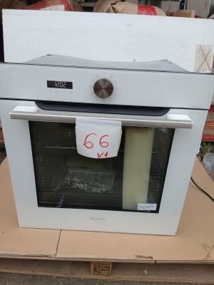 a white oven sitting on top of a cardboard box