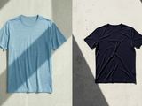 two men ' s t - shirts hanging on a wall next to each other