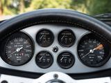a steering wheel and gauges in a car