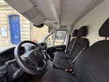 the interior of a van with black leather seats and a steering wheel