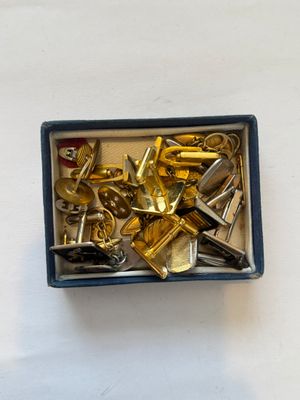 a box with a bunch of keys in it on a table