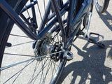 a close up view of a bicycle parked on the side of the road