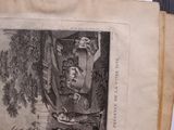 an old book with a picture of a man in a tree