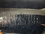 a close up of a black motorcycle with the name jean paul on it