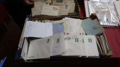 a box full of old letters and papers on a table