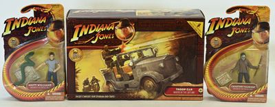 three action figures of a man in a car and a woman in a car