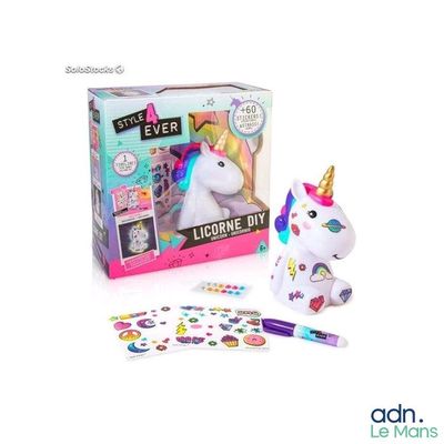 the unicorn is next to a box of stickers and a pen
