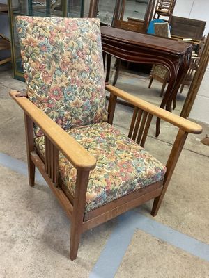 a chair that is sitting in the middle of a room