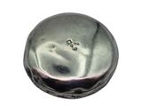 a close up of a silver object on a white background