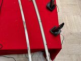 two swords and a pair of shoes on the floor