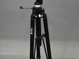 a close up of a tripod with a camera on top of it