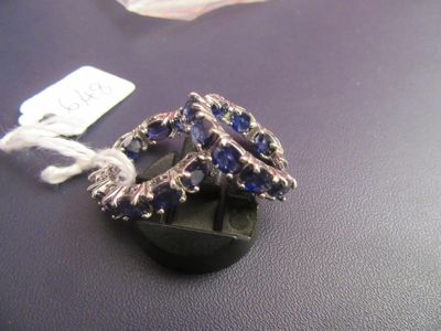 a ring that is sitting on a table with a tag