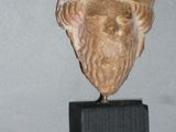 a statue of a man with a hat on it ' s head