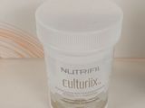 a jar of nutrifil sitting on a counter next to a bottle of nutrifil