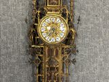 a clock on the wall that is hanging on the wall