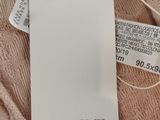 a tag that says zarnome on it next to a cell phone