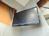 a flat screen tv mounted on a wall in a room