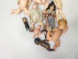 a lot of dolls that are sitting on a table