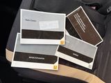 three books sitting on the back of a car seat