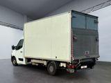 a white truck that is parked in a room