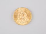 an image of a gold coin on a white surface