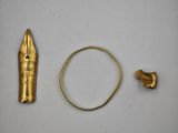 an image of a gold ring and a gold ring on a white surface