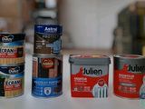 several different types of paint are sitting on a table