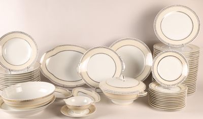 a lot of plates and bowls on the table